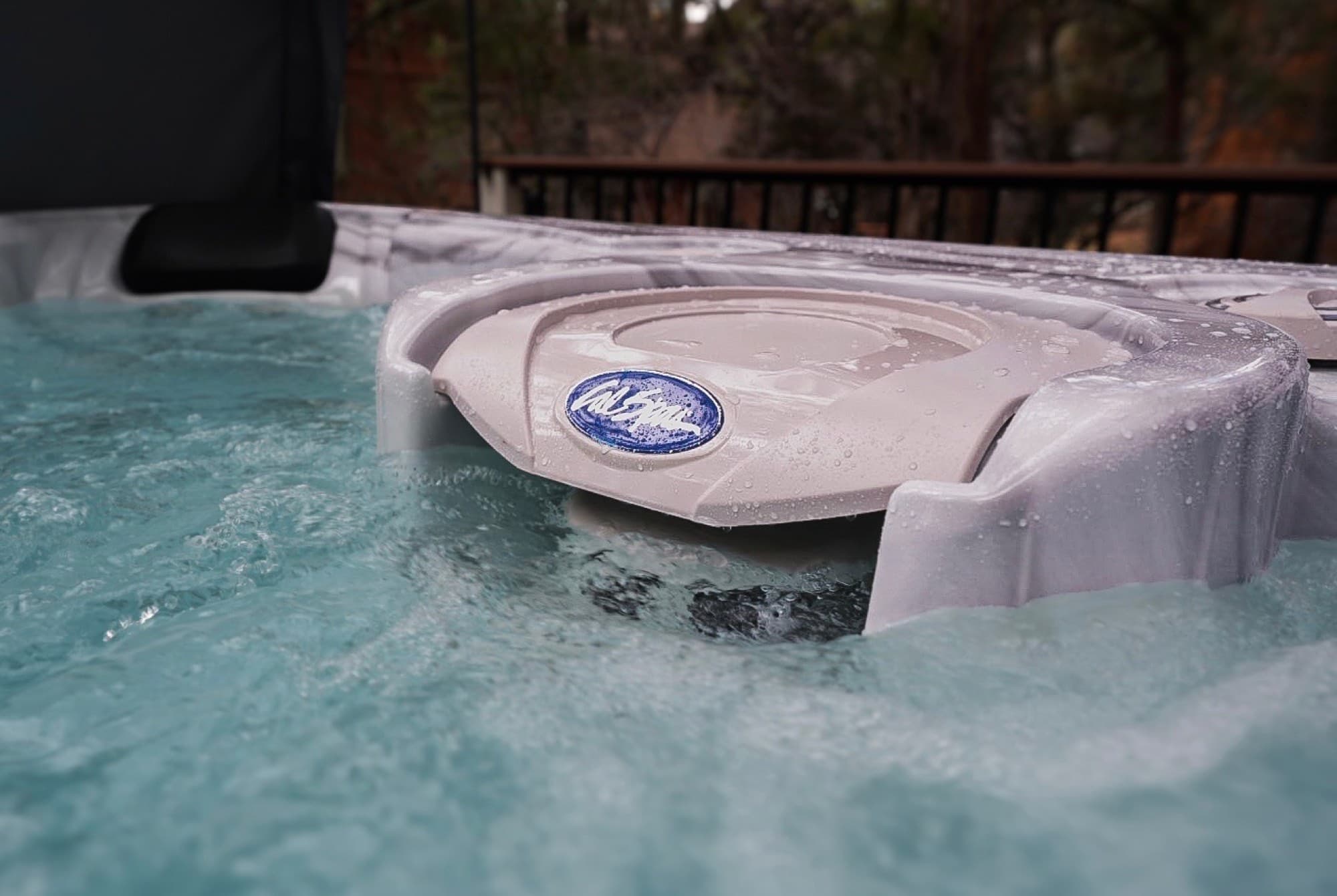 Close-up of a running Cal Spas tub with the brand badge