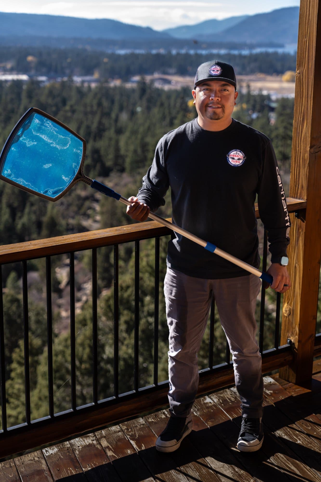 A Pinnacle Tubs team member above Big Bear Lake