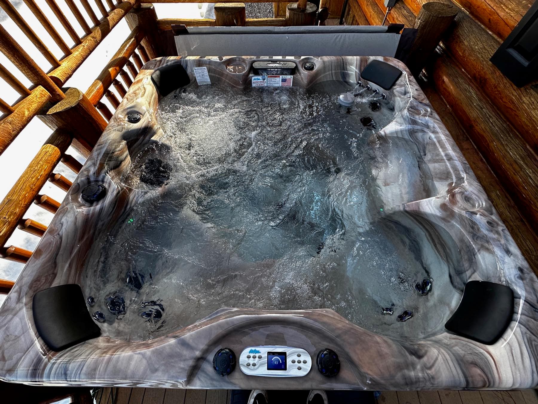 Overhead close-up of a running spa on a cabin deck